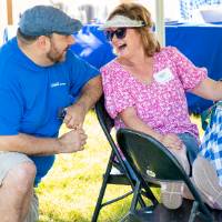 Student affairs staff member chatting with alum, Leslie Riley